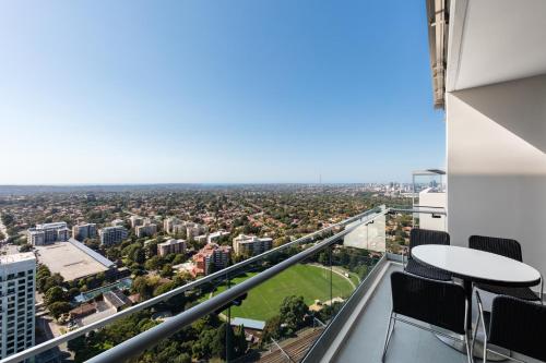 a large building with a view of the ocean at Meriton Suites Chatswood in Sydney