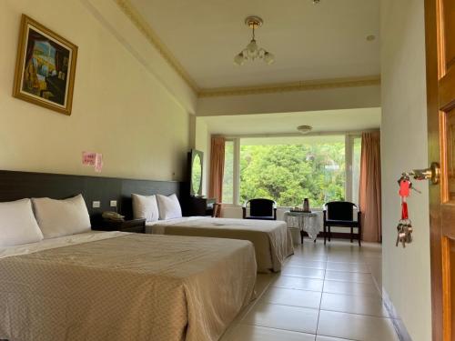Tempat tidur dalam kamar di Da Fang Hua Yuan Xiao Homestay