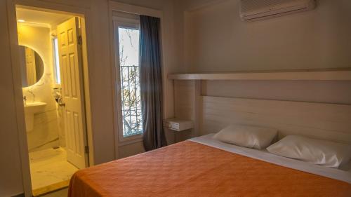 Postel nebo postele na pokoji v ubytování Muskebi Apart Otel