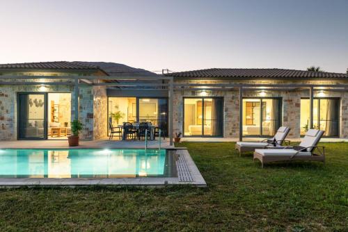 a house with a swimming pool in the yard at Villa Angelos in Katelios