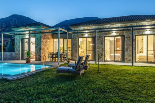 a house with a swimming pool in the yard at Villa Angelos in Katelios