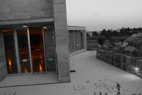 a building with glass doors on the side of it at Lousada Country Hotel in Lousada