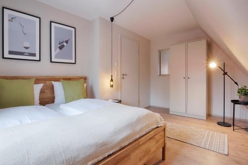 Ένα ή περισσότερα κρεβάτια σε δωμάτιο στο homie stay Julius Apartments - Iphofen