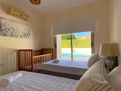 Postel nebo postele na pokoji v ubytování Luxury Villa Phaedra