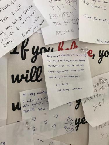 a pile of papers with writing on them at Minima 8 in George Town