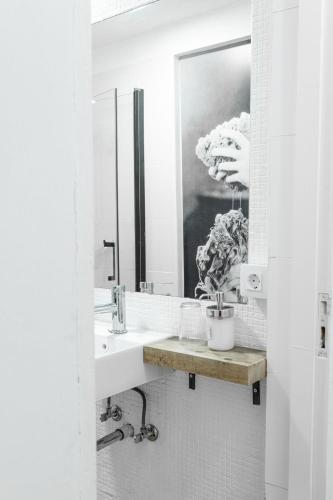 a bathroom with a sink and a mirror at Mapango Small Rooms in Santa Cruz de Tenerife