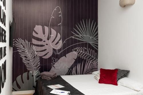 A bed or beds in a room at Mapango Small Rooms
