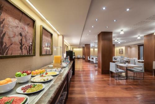 a buffet line with plates of food on it at Crisol Almirante Bonifaz in Burgos