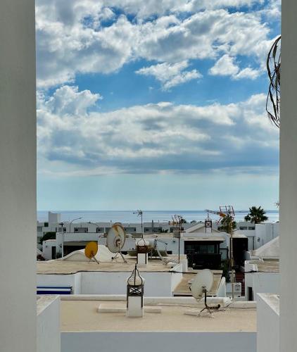 Cozy and sunny apartment over the rooftops