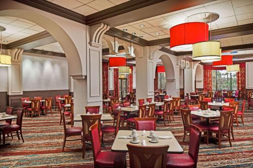 a large dining room with tables and chairs at Wyndham Lake Buena Vista Resort Disney Springs® Resort Area in Orlando