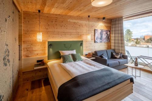 En eller flere senger på et rom på Landgasthof Hubertus - Braugasthof und Wellnesshotel im Allgäu