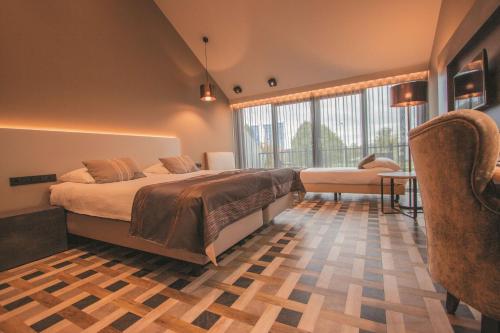 Tempat tidur dalam kamar di Best Western Hotel Nobis Eindhoven-Venlo A67