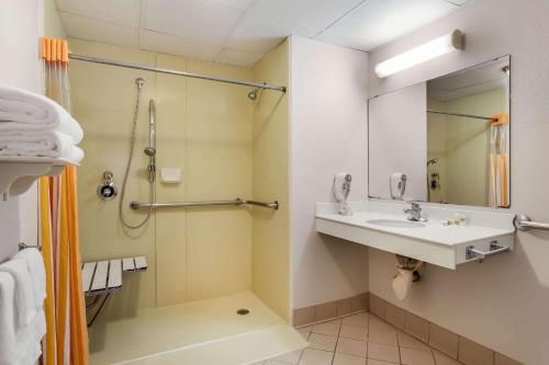 a bathroom with a sink and a shower at La Quinta by Wyndham St. Pete-Clearwater Airport in Clearwater