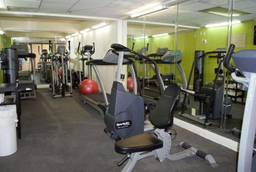 a gym with a bunch of tread machines in it at La Quinta Inn by Wyndham Austin Capitol / Downtown in Austin