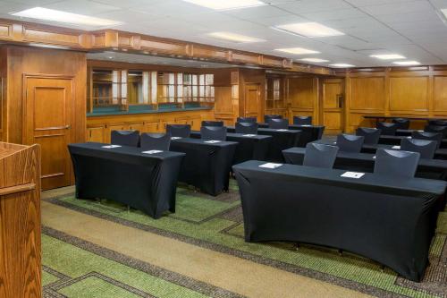 a conference room with black tables and chairs at La Quinta Inn by Wyndham Austin Capitol / Downtown in Austin