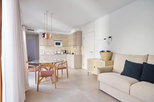 a living room with a couch and a table at Slow Home Apartments in Valencia
