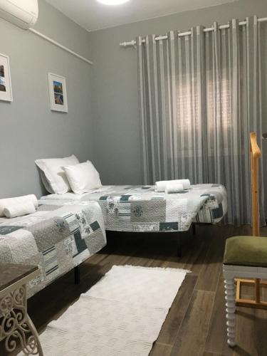 Кровать или кровати в номере Casa dos Capinha
