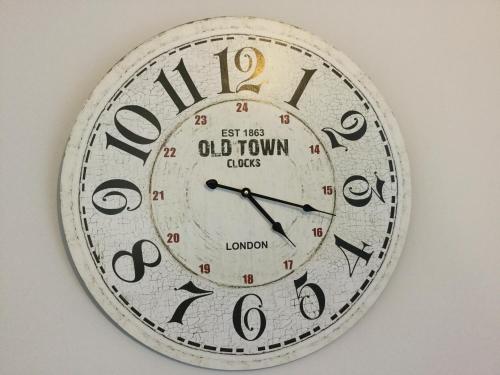 a clock that is on a wall at Apartment Marit in Norden