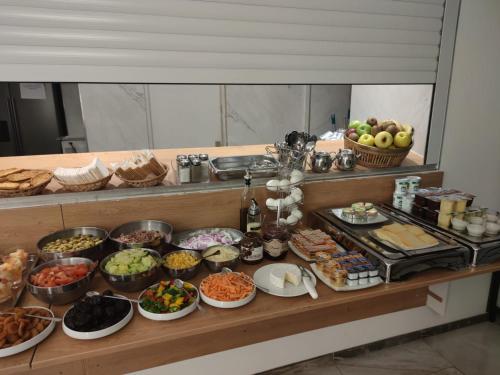 a buffet with many different types of food on a table at Hotel Aida Opera in Paris