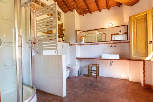 a bathroom with a shower and a toilet and a sink at Ginestraio in Santalbino by VacaVilla in Sorrezzana