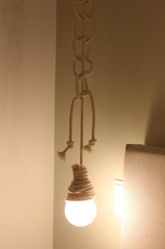 a light that is hanging from a ceiling at Hotel Benois in Galissas