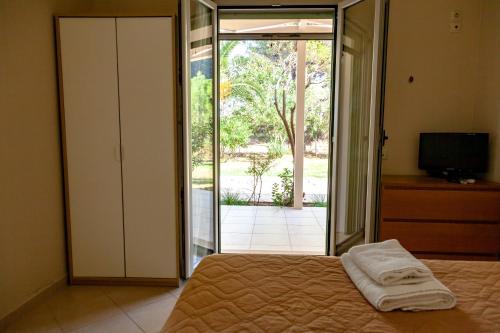 Postel nebo postele na pokoji v ubytování Brunello Seaside Apartments