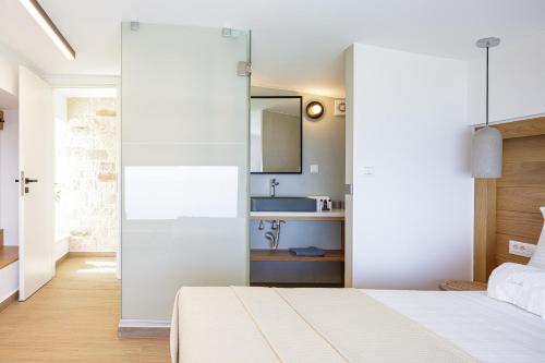 Postel nebo postele na pokoji v ubytování Oneiric Exclusive Villas