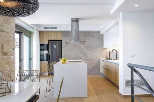 Kuchyň nebo kuchyňský kout v ubytování Oneiric Exclusive Villas