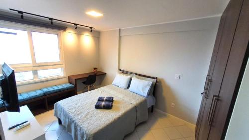 מיטה או מיטות בחדר ב-Pontamares 1304 Ponta Negra