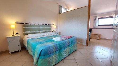 A bed or beds in a room at A Viterbo Terme "Casa Vacanze Al Melograno"