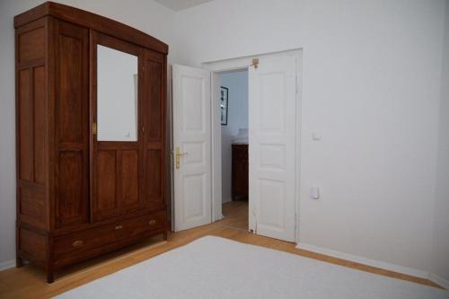 a room with a wooden cabinet and a door at Ohrid Center Galerie House in Ohrid