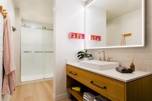 a bathroom with a sink and a mirror at Dr Wilkinsons Backyard Resort and Mineral Springs a Member of Design Hotels in Calistoga