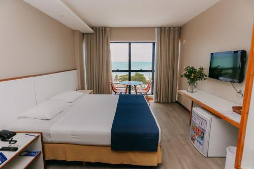 Postel nebo postele na pokoji v ubytování Pajuçara Praia Hotel