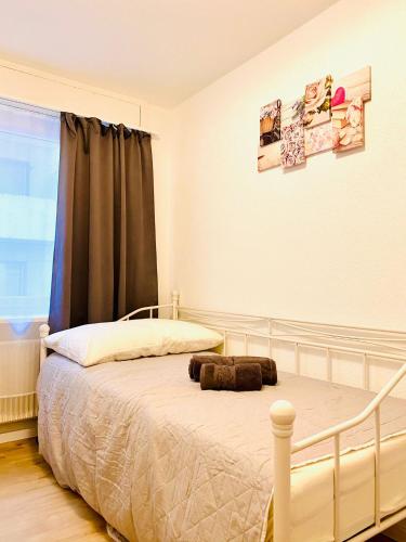 a bedroom with a bed and a window at City Center Premium Apartment - Buchs SG in Buchs