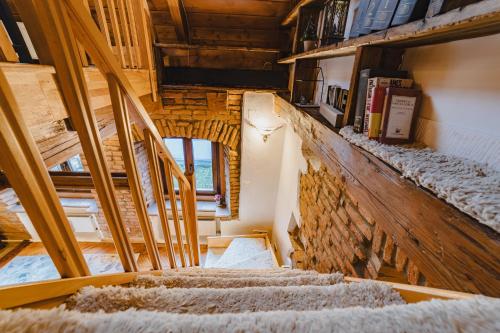 an overhead view of stairs in a tiny house at ALBERT RESIDENCE Aparthotel in Braşov