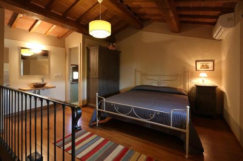 a bedroom with a bed in a room at Agriturismo La Dolce Vista in Poppi