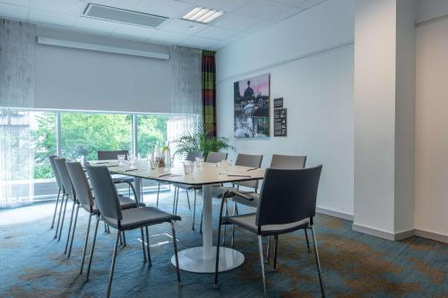a conference room with a table and chairs at Radisson Blu Hotel Uppsala in Uppsala