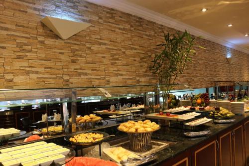a buffet line with many different types of food at Radisson Blu Hotel, Yanbu in Yanbu