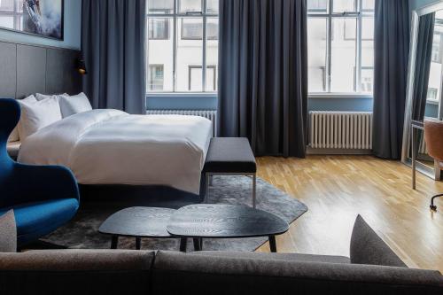 Postel nebo postele na pokoji v ubytování Radisson Blu 1919 Hotel, Reykjavík