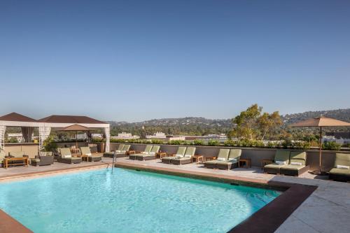 a swimming pool on the roof of a hotel at L'Ermitage Beverly Hills in Los Angeles