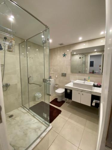 a bathroom with a shower and a toilet and a sink at Tawaya Sahl Hasheesh in Hurghada