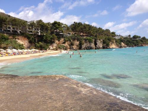 a group of people in the water at a beach at Iris Apartments in Minia