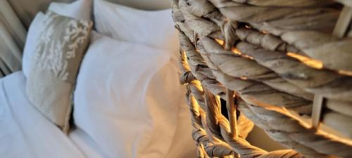 a close up of a blanket on a bed at Hotel Mango Airport in Alajuela City