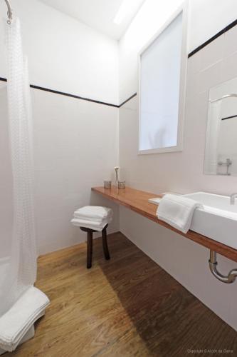 a bathroom with a sink and a mirror at Oporto River and Ribeira Views in Vila Nova de Gaia