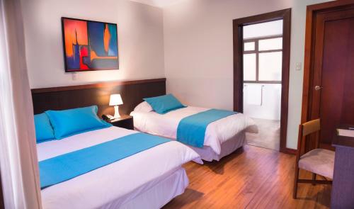 Een bed of bedden in een kamer bij Hostal Casa de Lidice