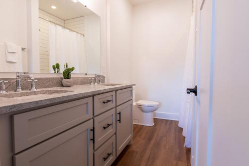 a white bathroom with a sink and a toilet at The Getaway Blowing Rock in Blowing Rock