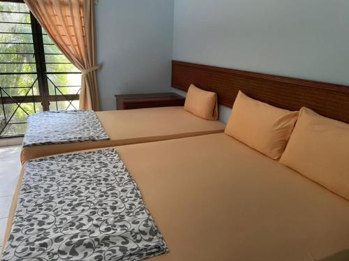 Giường trong phòng chung tại Villa Mommy A Famosa Resort