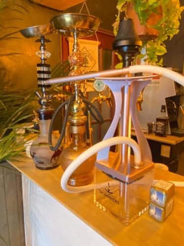 a desk with a fan and a scale on it at Kaido Yuzawa Onsen Hostel in Yuzawa