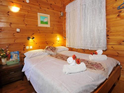 Ένα ή περισσότερα κρεβάτια σε δωμάτιο στο The Galilee Cabin
