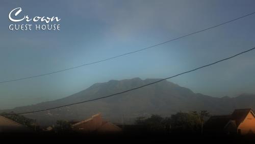a view of a mountain from a city at Crown Guest House in Ambarawa
